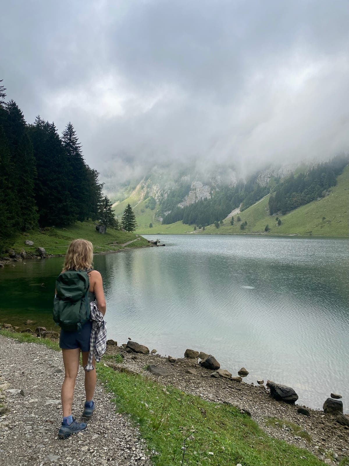 Annie Pezza, Pinerary’s founder, on a lakeside trail in the Swiss Alps
